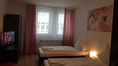 Łóżko lub łóżka w pokoju w obiekcie Hotelik Kameleon Pokoje Gościnne