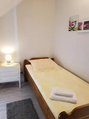 Łóżko lub łóżka w pokoju w obiekcie Agroturystyka u Kasi