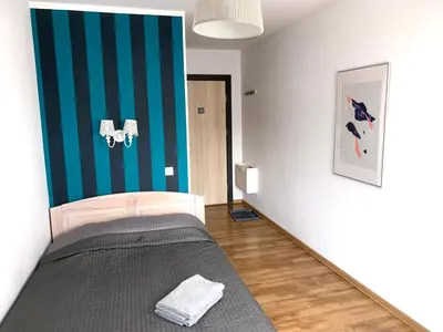 Łóżko lub łóżka w pokoju w obiekcie Willa Zdrój