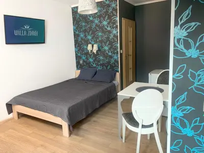 Łóżko lub łóżka w pokoju w obiekcie Willa Zdrój