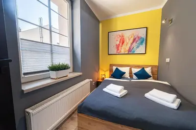 Łóżko lub łóżka w pokoju w obiekcie Kaktus Chill & Sleeping - 50 m od Rynku