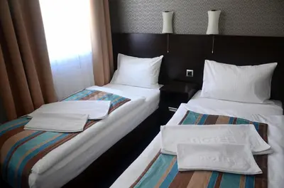 Łóżko lub łóżka w pokoju w obiekcie Hotel Kamienica