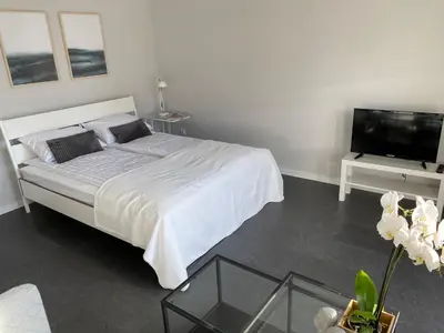 Łóżko lub łóżka w pokoju w obiekcie APARTAMENT ŚMIAŁEGO 9