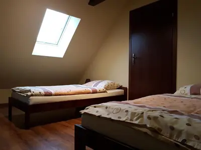 Łóżko lub łóżka w pokoju w obiekcie Kamienna Polana