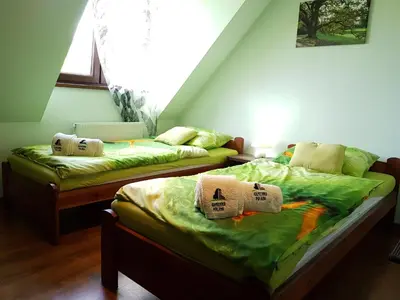 Łóżko lub łóżka w pokoju w obiekcie Kamienna Polana