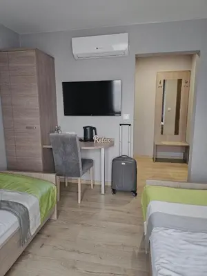 Łóżko lub łóżka w pokoju w obiekcie Restauracja i Noclegi Pod Kasztanami