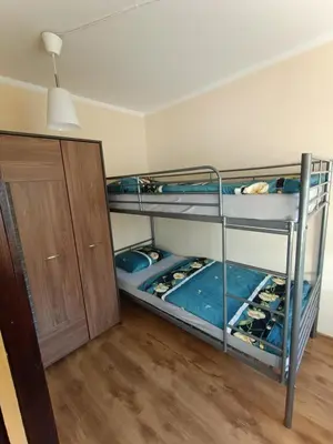 Łóżko lub łóżka w pokoju w obiekcie Mieszkanie w centrum