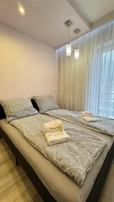 Łóżko lub łóżka w pokoju w obiekcie Polanica Luxury Apartment - Bliżej Zdroju