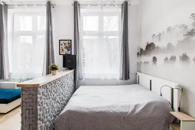 Łóżko lub łóżka w pokoju w obiekcie Wroclaw Central City Apartments- Self Check-in 24h, WiFi
