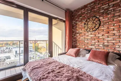 Łóżko lub łóżka w pokoju w obiekcie Glamour Apartment City View