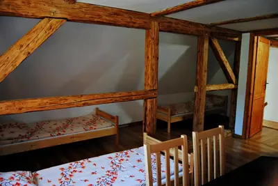 Łóżko lub łóżka w pokoju w obiekcie Sudecka Chata