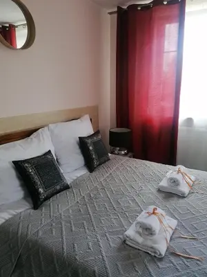 Łóżko lub łóżka w pokoju w obiekcie Villa Zdrojowa