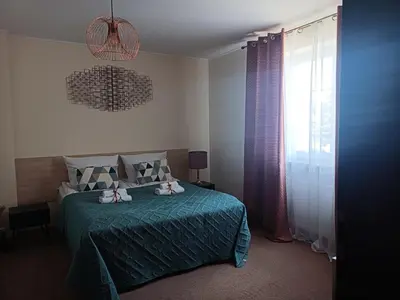 Łóżko lub łóżka w pokoju w obiekcie Villa Zdrojowa