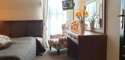 Łóżko lub łóżka w pokoju w obiekcie Hotel Zorza