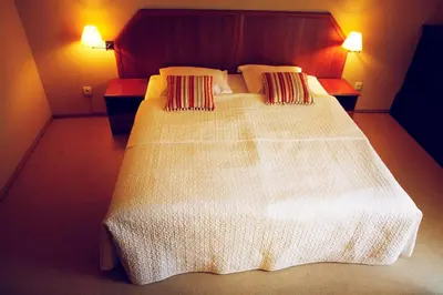 Łóżko lub łóżka w pokoju w obiekcie Hotel Zorza