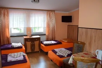Łóżko lub łóżka w pokoju w obiekcie Ośrodek Wypoczynkowy Pod Szczelińcem