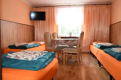 Łóżko lub łóżka w pokoju w obiekcie Ośrodek Wypoczynkowy Pod Szczelińcem