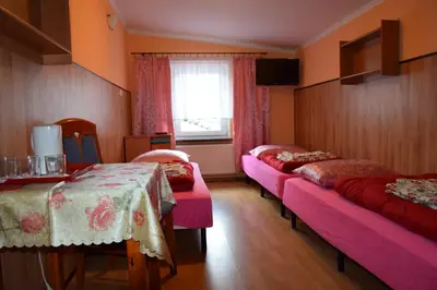 Łóżko lub łóżka w pokoju w obiekcie Ośrodek Wypoczynkowy Pod Szczelińcem