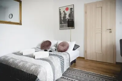 Łóżko lub łóżka w pokoju w obiekcie Apartament Nectar Pond
