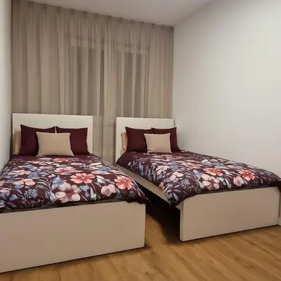 Łóżko lub łóżka w pokoju w obiekcie TK Apartments Namysłów