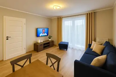 Telewizja i/lub zestaw kina domowego w obiekcie TK Apartments Namysłów