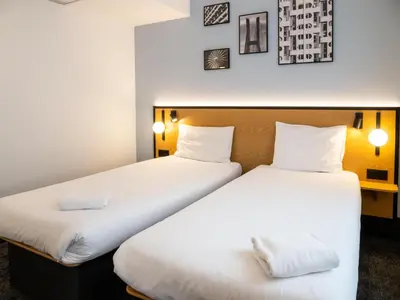 Łóżko lub łóżka w pokoju w obiekcie B&B HOTEL Wrocław Centrum