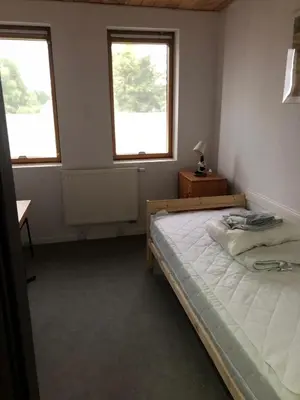 Łóżko lub łóżka w pokoju w obiekcie Kwatery Mamma Mia Opawska 1a