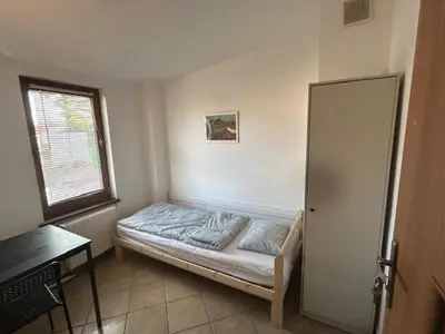 Łóżko lub łóżka w pokoju w obiekcie Kwatery Mamma Mia Opawska 1a