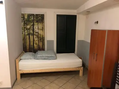 Łóżko lub łóżka w pokoju w obiekcie Kwatery Mamma Mia Opawska 1a