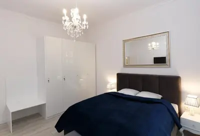 Łóżko lub łóżka w pokoju w obiekcie KDRO Apartment Rynek