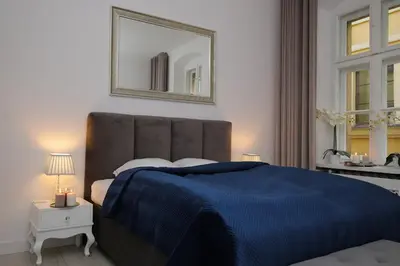 Łóżko lub łóżka w pokoju w obiekcie KDRO Apartment Rynek
