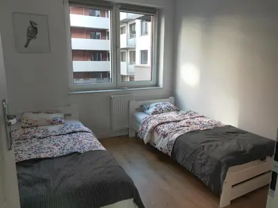 Łóżko lub łóżka w pokoju w obiekcie MAGLONIA APARTMENT