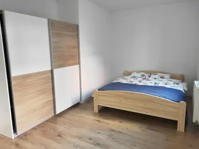 Łóżko lub łóżka w pokoju w obiekcie MAGLONIA APARTMENT