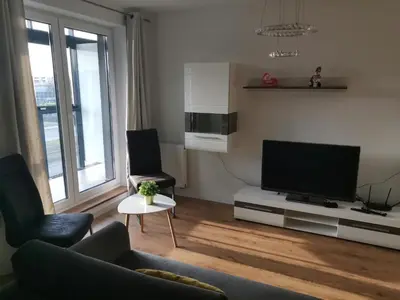 Telewizja i/lub zestaw kina domowego w obiekcie MAGLONIA APARTMENT