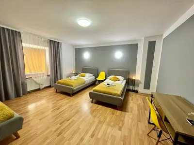 Łóżko lub łóżka w pokoju w obiekcie Great Polonia Strzegom City Center
