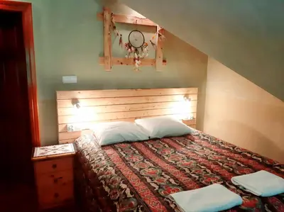 Łóżko lub łóżka w pokoju w obiekcie Schronisko Bukowa Chata
