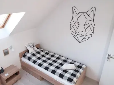 Łóżko lub łóżka w pokoju w obiekcie Ruda Sowa