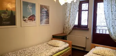 Łóżko lub łóżka w pokoju w obiekcie Apartament Międzygórze