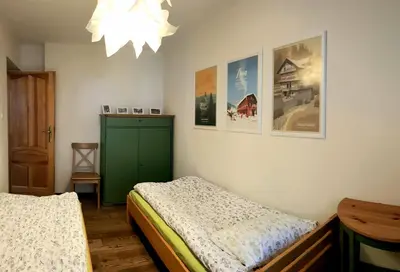 Łóżko lub łóżka w pokoju w obiekcie Apartament Międzygórze