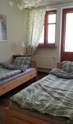 Łóżko lub łóżka w pokoju w obiekcie Apartament Międzygórze