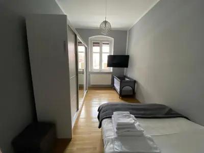Łóżko lub łóżka w pokoju w obiekcie Apartament F21 Deluxe w Bielawie - Widok na Góry Sowie