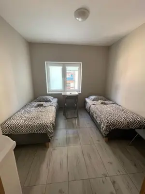 Łóżko lub łóżka w pokoju w obiekcie Lawendowy Hostel Wrocław