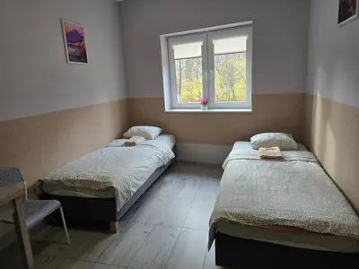 Łóżko lub łóżka w pokoju w obiekcie Lawendowy Hostel Wrocław