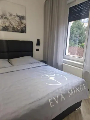 Łóżko lub łóżka w pokoju w obiekcie Vena Apartments