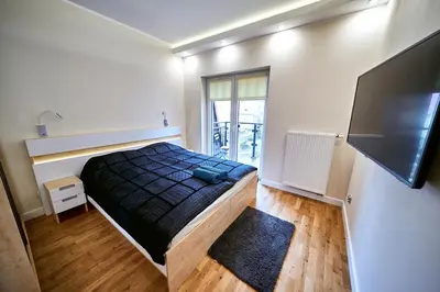 Łóżko lub łóżka w pokoju w obiekcie LAGUNA Apartament 23 Willa Maria