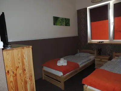 Łóżko lub łóżka w pokoju w obiekcie BoomerangHouse