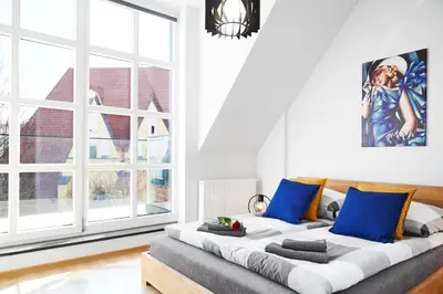Łóżko lub łóżka w pokoju w obiekcie Prestige Apartments 12