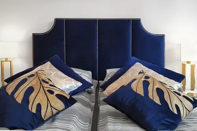 Łóżko lub łóżka w pokoju w obiekcie Prestige Apartments 12