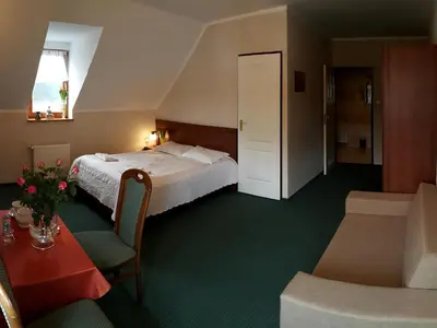 Łóżko lub łóżka w pokoju w obiekcie Zajazd Byczy Róg
