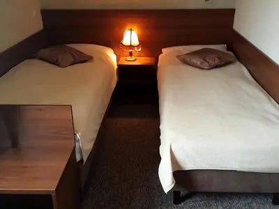 Łóżko lub łóżka w pokoju w obiekcie Zajazd Byczy Róg